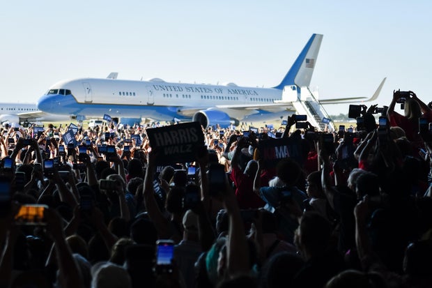 Crowd of supporters wait for a Harris-Walz campaign rally at Detroit airport