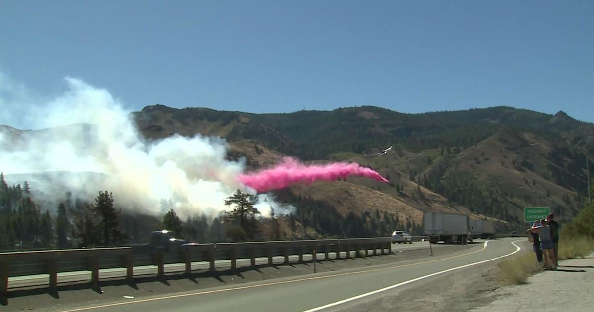 Forest fire along the California-Nevada border near Reno destroys one home and threatens hundreds more