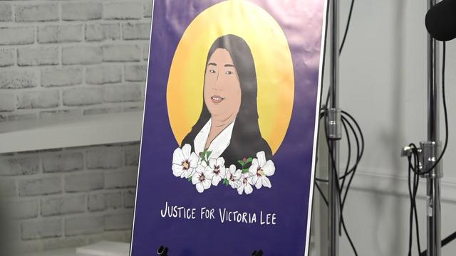 A sign reading "Justice for Victoria Lee" along with an illustration of Victoria Lee. 