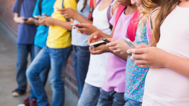 pupils using mobile phone 