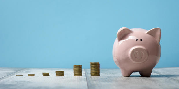 Piggy bank isolated on blue background 