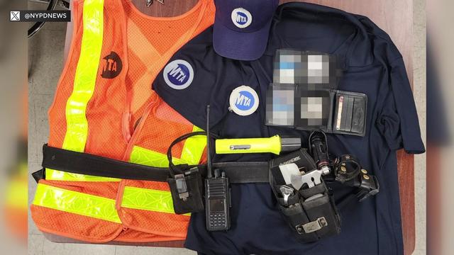 a photo of a t-shirt, hat and orange vest with the MTA logo on them, along with a toolbelt that had a walkie-talkie and a flashlight with an MTA sticker on it, among other tools. 