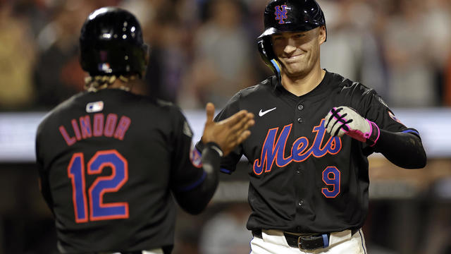 Brandon Nimmo (R) #9 of the New York Mets reacts with Francisco Lindor #12 of the New York Mets after hitting a three-run home run during the fourth inning against the Miami Marlins at Citi Field on August 16, 2024 in New York City. 