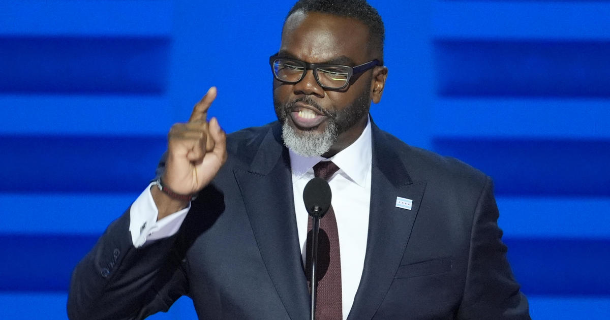 Chicago Mayor Brandon Johnson greets delegates at the opening of the DNC