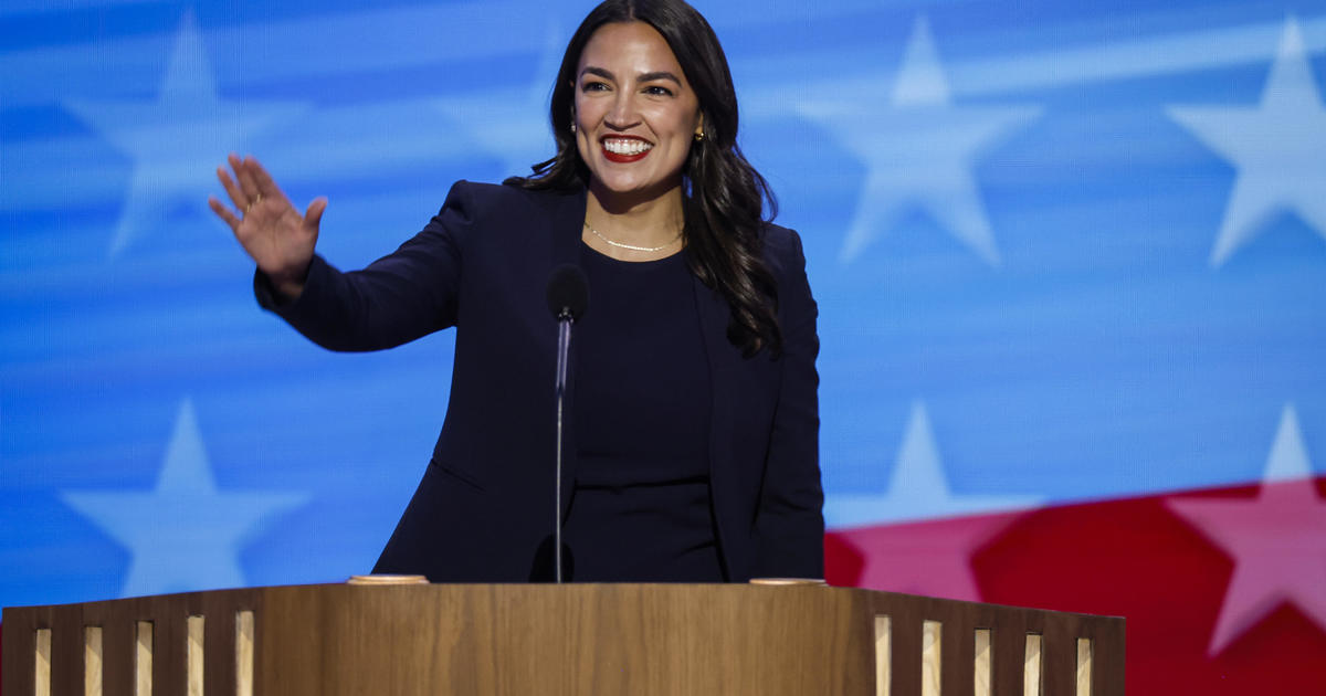 Rep. Alexandria Ocasio-Cortez urges Democrats to "choose a new path" in raucous DNC speech