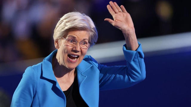 Sen. Elizabeth Warren of Massachusetts waves as she leaves the stage after speaking on the fourth and last day of the Democratic National Convention at the United Center in Chicago on Aug. 22, 2024. 