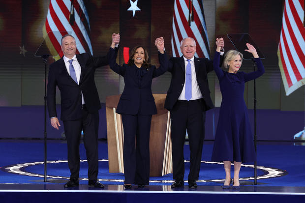 Vice President Kamala Harris celebrates with her husband, Doug Emhoff, and vice presidential nominee Minnesota Gov. Tim Walz, and his wife Gwen, following her acceptance speech on Day 4 of the Democratic National Convention in Chicago, Aug. 22, 2024. 