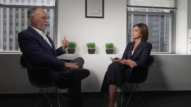 CUNY Chancellor Dr. Felix Matos Rodriguez sits in a chair opposite Kristine Johnson during an interview 