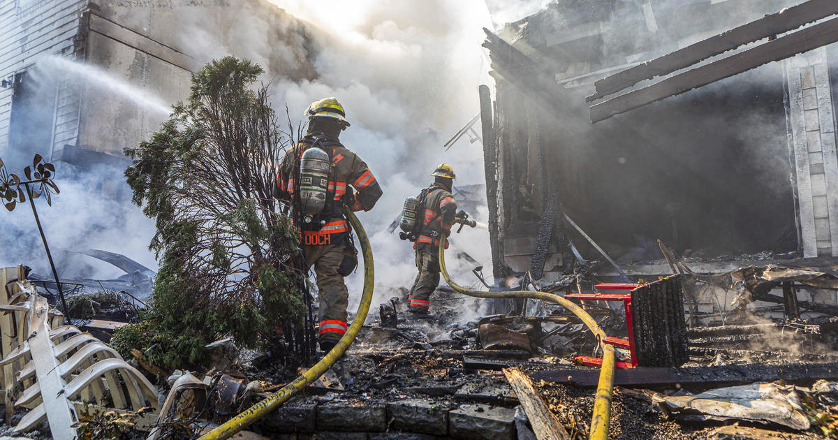 Small plane crashes into Oregon residential building near Portland, engulfing condos in fire, officials say