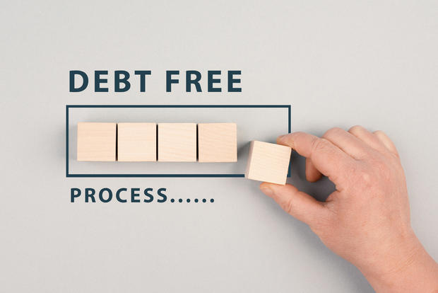 The words debt free in process are standing next to the loading bar, ending credit payments and bank loans, financial freedom 