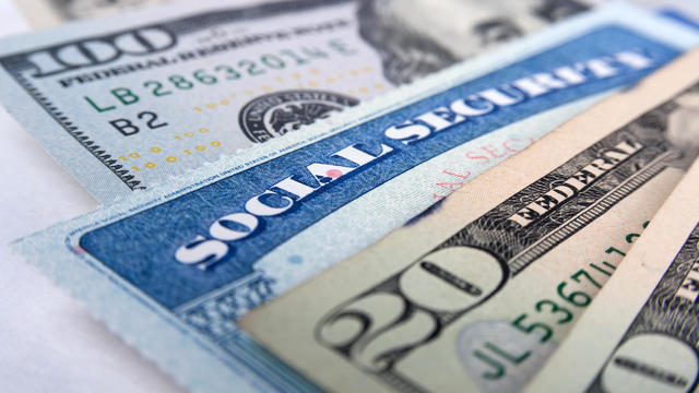 Social security card and American money dollar bills 