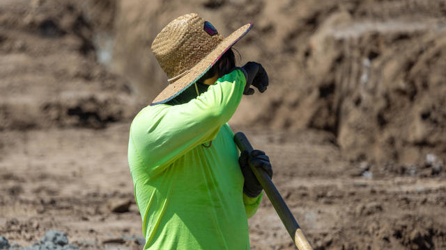 Construction workers work amidst a heat wave in Irvine 