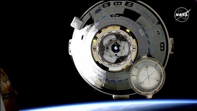 Boeing's troubled Starliner, leaving its crew behind, departs space station for unpiloted return to Earth