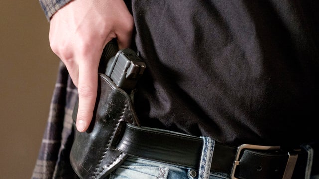 Man with Handgun in Holster 