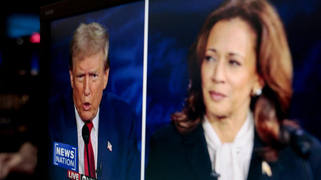 Former President Donald Trump and Vice President Kamala Harris are shown on screen in the spin room during the second presidential debate at the Pennsylvania Convention Center in Philadelphia, Pennsylvania, US, on Tuesday, Sept. 10, 2024. 