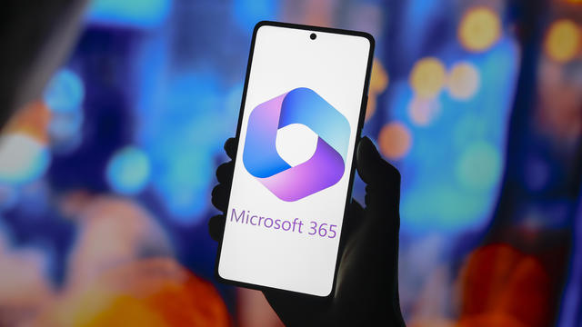 In this photo illustration, the Microsoft 365 logo is 