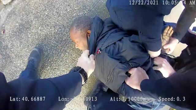 Police body camera footage shows at least three officers restraining and handcuffing Tyrone Phifer, who is lying facedown on the ground. 