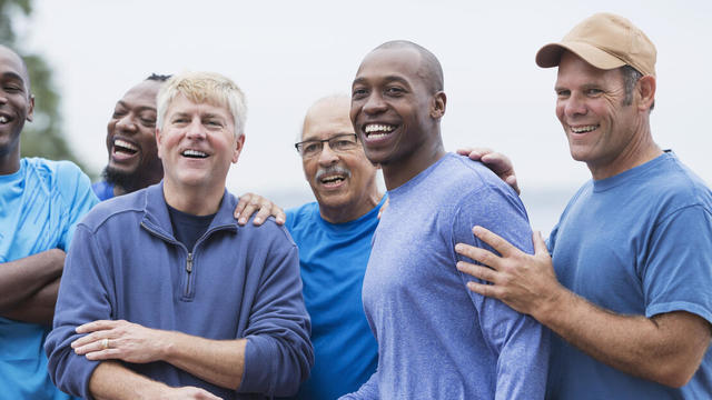 Diverse group of men standing together 