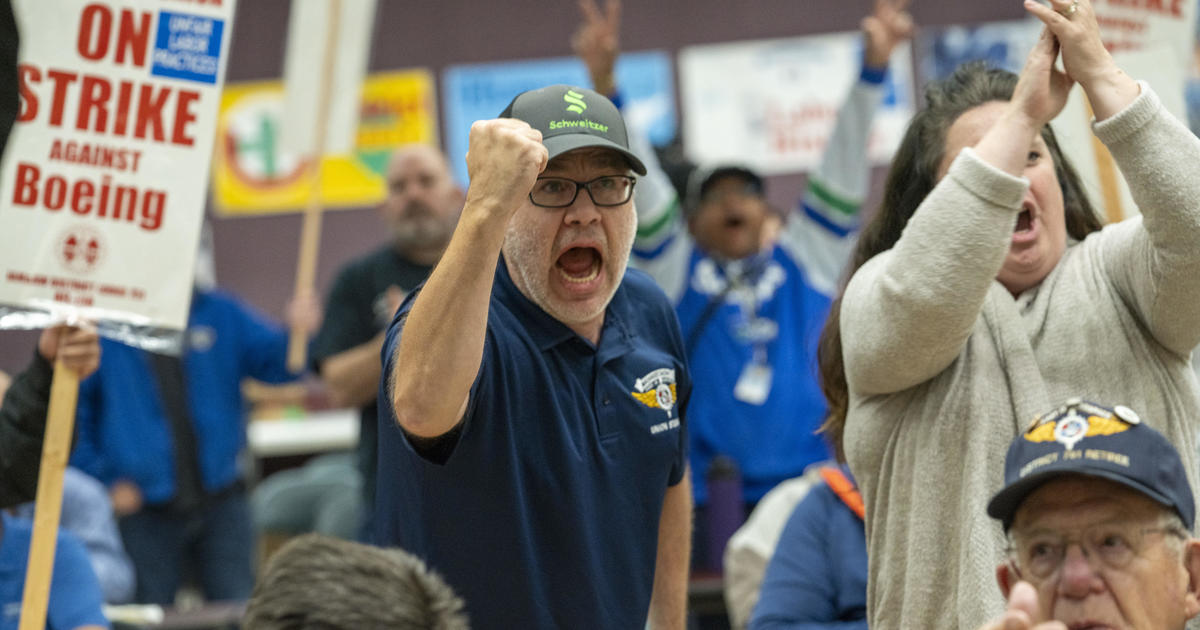 Boeing workers go on strike after overwhelming votes to reject contract offer and walk off the job