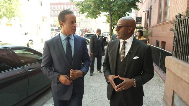 Maurice DuBois and Rev. Dr. Kevin Johnson on the sidewalk outside Abyssinian Baptist Church 