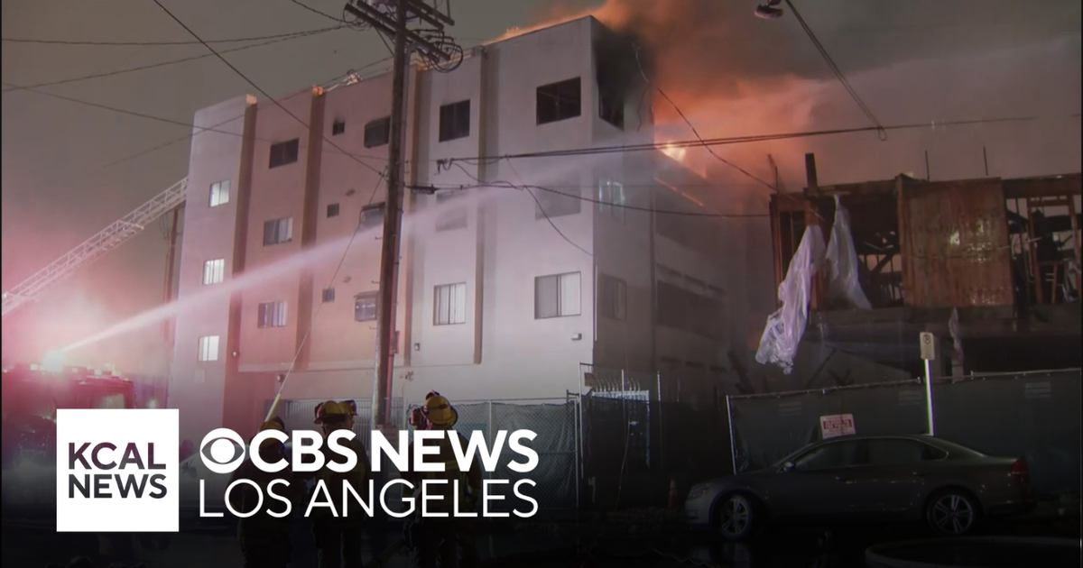 Dozens displaced after fire rips through Chinatown apartment complex ...