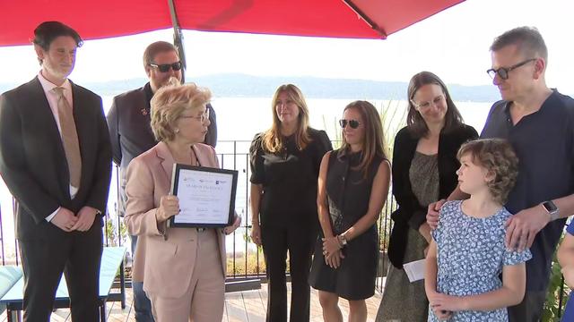 Sen. Shelley Mayer stands alongside several others as she accepts an award for her work in the fight to help families affected by pediatric cancer. 