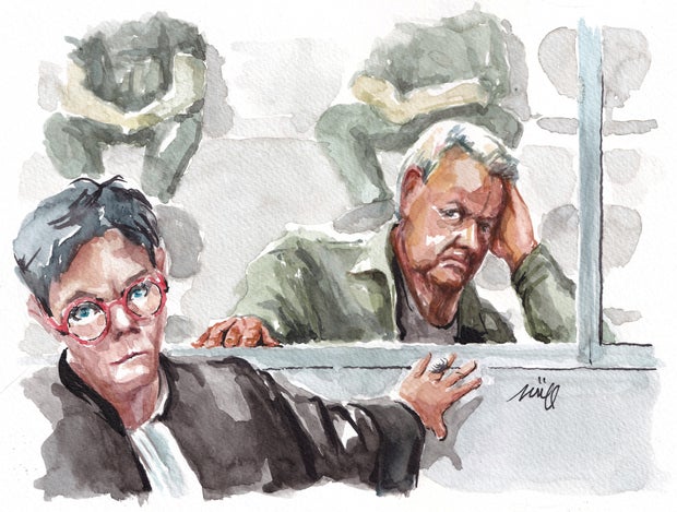 Dominique Pelicot, who has admitted to drugging and raped his wife Gisele Pelicot, appears behind his lawyer as she address the court in Avignon, France