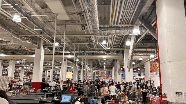 Crowded busy Costco checkout and food court area, Queens, New York 