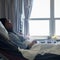 Sick patient lying in hospital bed 