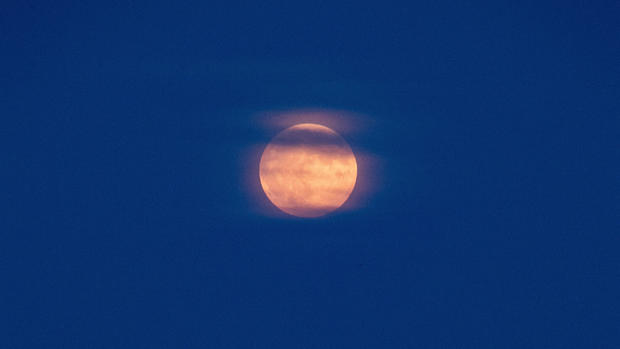 Supermoon rises over Scituate Lighthouse in Massachusetts 