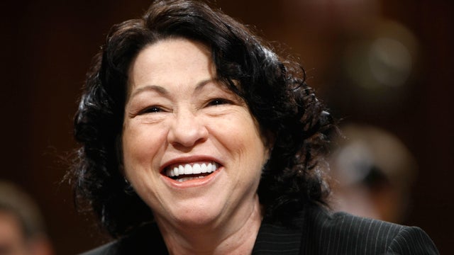Judge Sonia Sotomayor smiles as she arrives for the third day of Supreme Court confirmation hearings before the Senate Judiciary Committee, July 15, 2009, in Washington. 