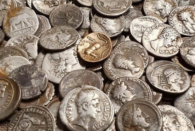 A metal detectorist inspired by Indiana Jones discovered a hoard of ancient coins. They just sold for $176,000.