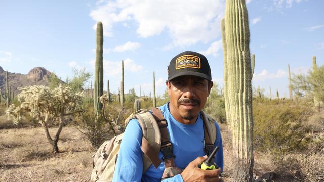 Roberto Resendiz, 48, reminds other members of the Armadillos via his walkie-talkie that Jose Luis Salinas Pineda was wearing black shoes and camo gear when he crossed the Arizona-Mexico border in early June. 