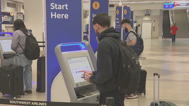 People use kiosks at Philadelphia International Airport 