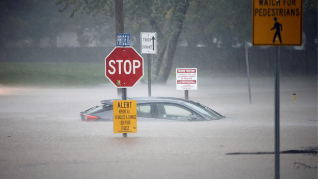 A stranded car sits in floodwaters as Tropical Storm Helene strikes, in Boone, North Carolina, Sept. 27, 2024. 