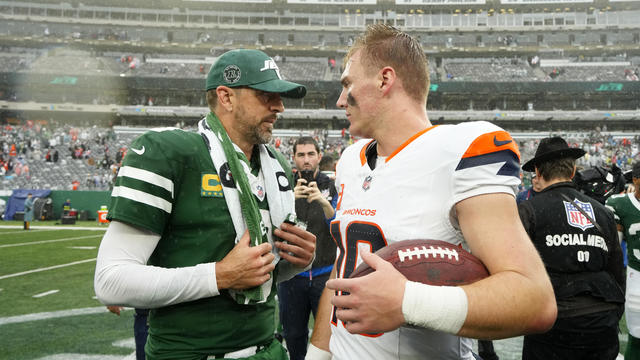 Aaron Rodgers (8) of the New York Jets and Bo Nix (10) of the Denver Broncos talk after the Broncos beat the Jets at MetLife Stadium on September 29, 2024 in East Rutherford, New Jersey. 