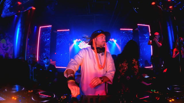 A DJ performs at a party 