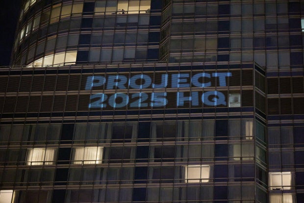 The Democratic National Committee Projects Images On Trump International Hotel In Chicago Ahead Of Their Convention In Chicago This Week