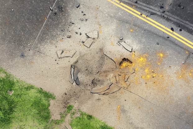 Bomb dropped by U.S. in World War II explodes at airport in Japan, causing runway damage and cancellation of 80 flights