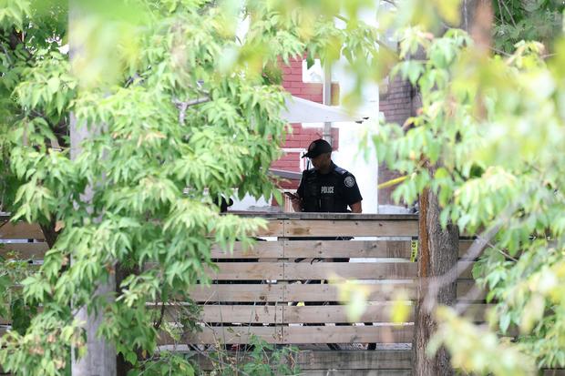 Police are seen outside the residence of alleged serial killer Sabrina Kauldhar in Toronto, Oct. 4, 2024. 