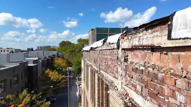 Drone footage shows where bricks from the building are missing 