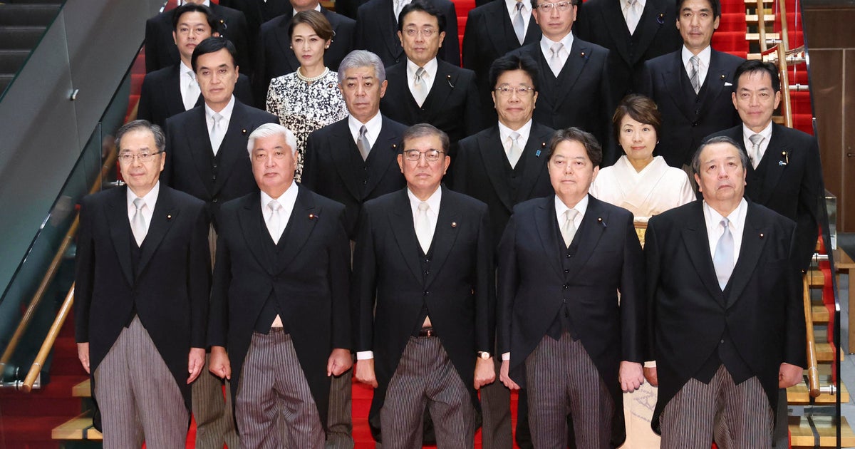 Japan government admits doctoring photo of new cabinet after online mockery  CBS News Japan government admits doctoring photo of new cabinet after online mockery  CBS News