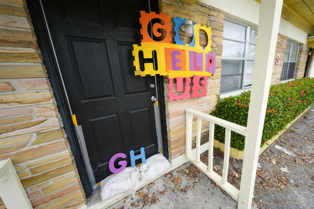 A message is seen outside an apartment in the Davis Islands community of Tampa, Florida, as residents prepare for the arrival of Hurricane Milton, Oct. 8, 2024. 