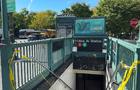 Torn crime scene tape at the entrance of the Utica Avenue subway station. 