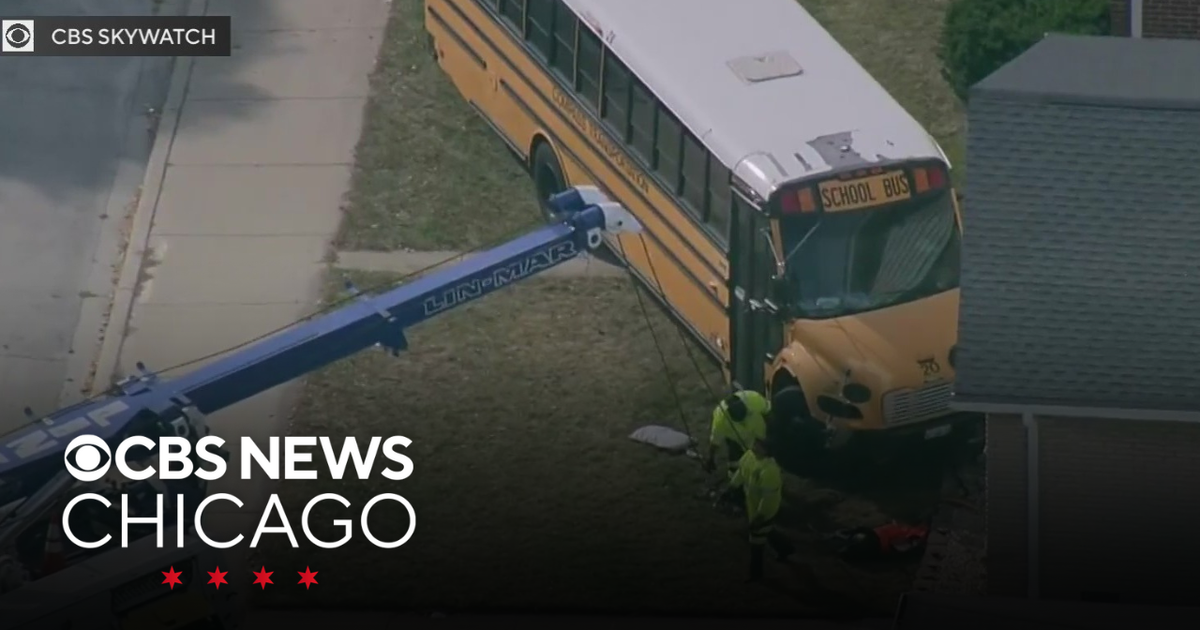 School bus crashes into home in Skokie; second car also towed - CBS Chicago