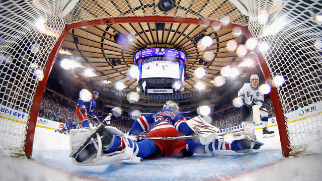 Clayton Keller #9 of Utah Hockey Club scores a second period goal against Igor Shesterkin #31 of the New York Rangers at Madison Square Garden on October 12, 2024 in New York City. The Utah Hockey Club defeated the Rangers 6-5 in overtime. 