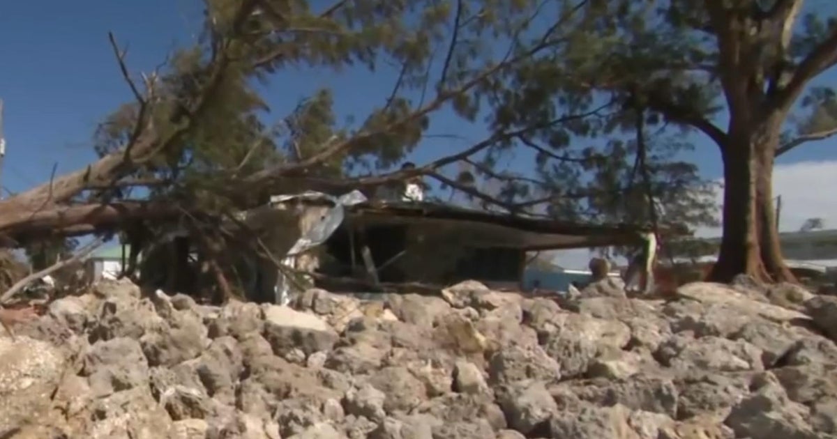 Florida residents face mountains of debris and mud, footage shows