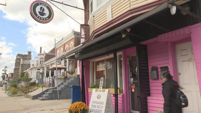 Exterior photo of a pink coffee shop in a North Philadelphia neighborhood 