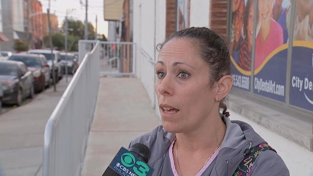 Laurie Zimbalardi speaks to a reporter into a CBS Philadelphia microphone 