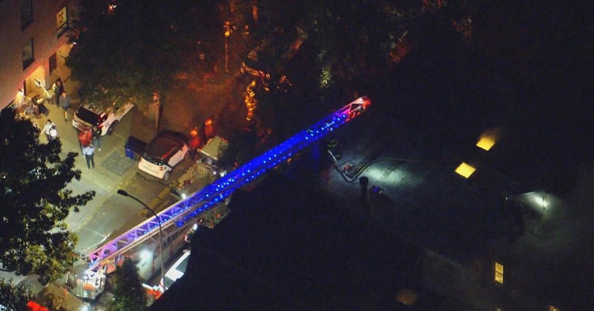 Philadelphia firefighters battle a house fire in Fairmount